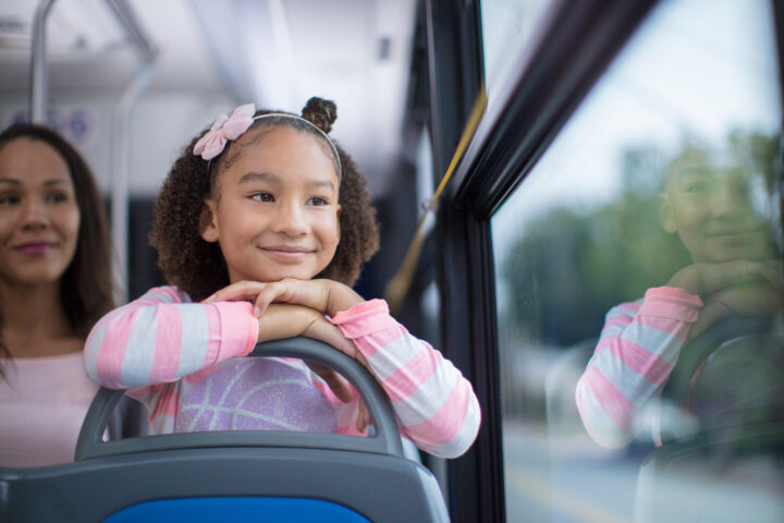 Young Girl Looking out the Bus Window