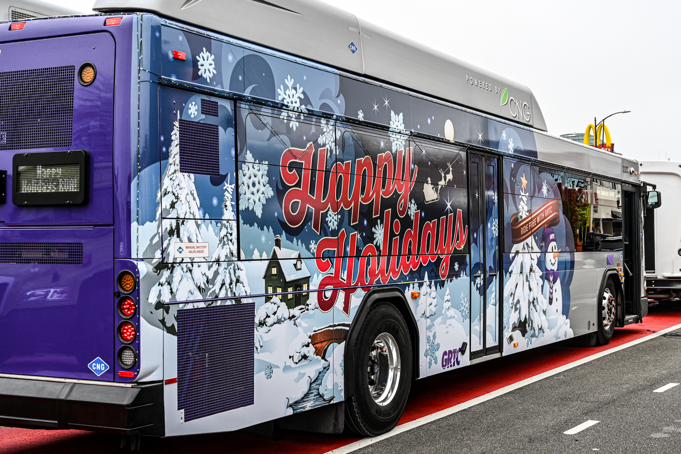 GRTC bus with winter wonderland scene on the side and text 