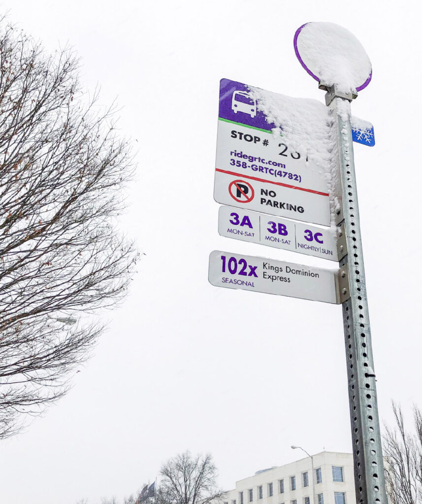 Snow accumulated on a sign for a GRTC bus stop