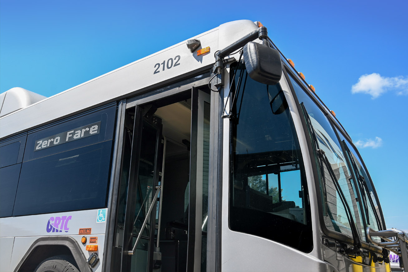 Bus with open door and sign that says Zero Fare